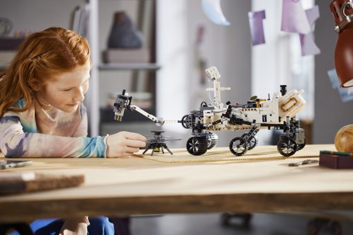 child playing with the LEGO Technic NASA Mars Rover Perseverance