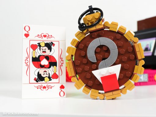 Queen of Hearts card in lego Alice in Wonderland and pocket watch representing Captain Hook from Peter Pan