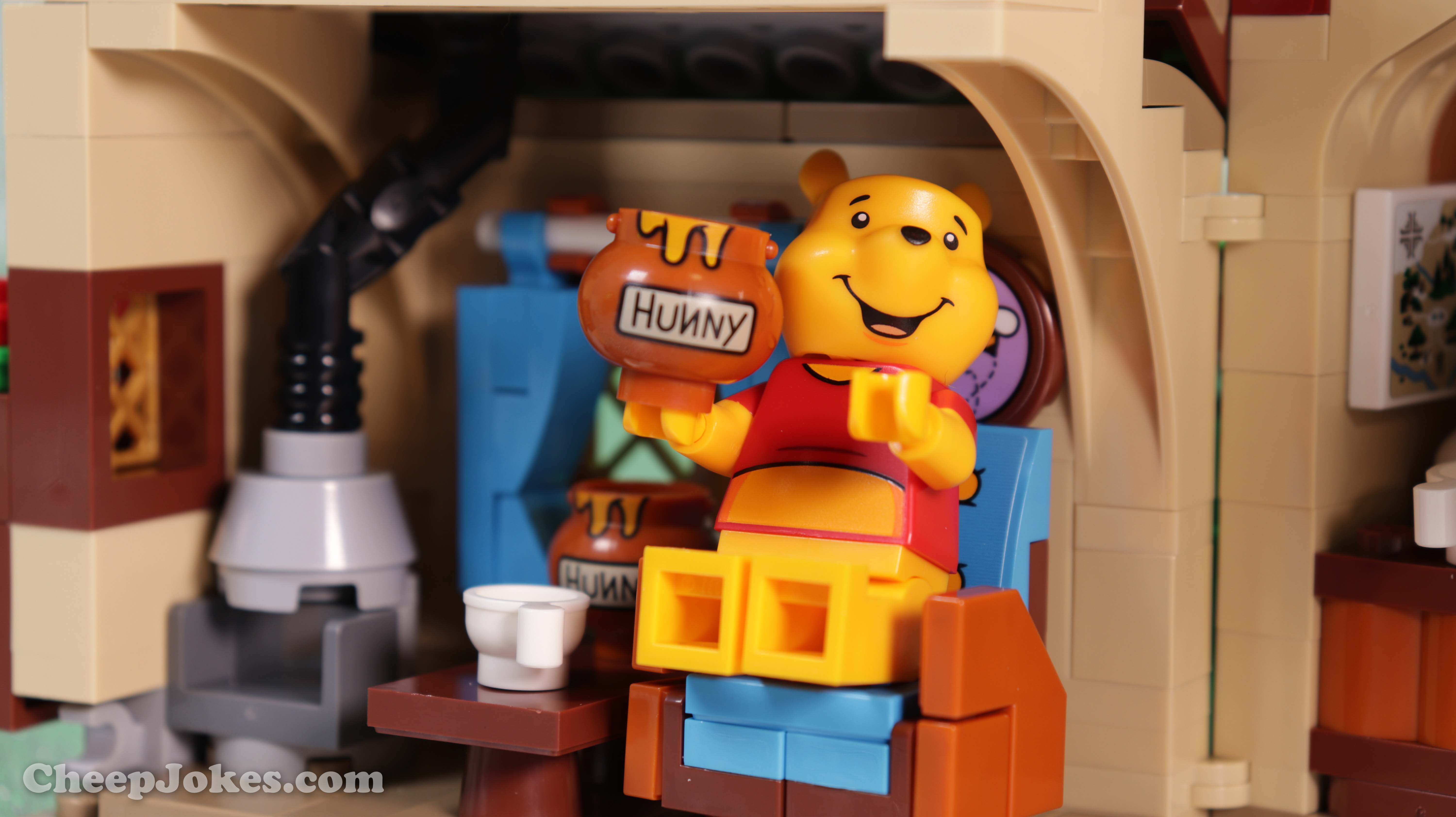 Take time out and rekindle joyful childhood memories with this LEGO® Ideas set (21326) featuring Disney’s Winnie the Pooh and a delightful LEGO brick recreation of Pooh Bear’s house under a big oak tree in Hundred Acre Wood. Great to build alone or with family, the house opens at the back for easy access to the authentic details inside, including Pooh’s buildable armchair, Pooh-Coo clock, Poohsticks, honey pot elements and much more. You can also create the effect of bees flying around beehives in the branches of the tree, like in the stories. Popular characters The model comes with Disney’s Winnie the Pooh, Piglet, Tigger and Rabbit minifigures, plus an Eeyore LEGO figure. The friends each have an accessory, including Winnie the Pooh’s buildable red balloon, to recreate classic scenes. Special gift Part of a collection of premium-quality LEGO building kits for adults, this set makes a charming gift for yourself, a Disney Winnie the Pooh enthusiast, LEGO fan or any hobbyist.