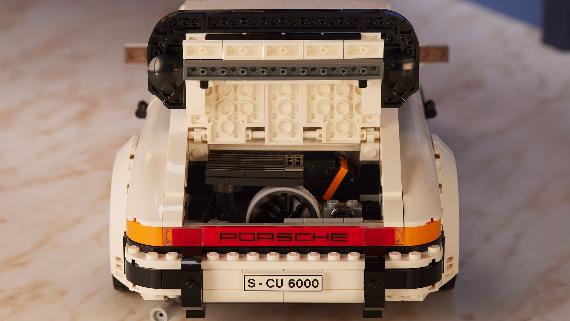 LEGO 10295 Porsche 911 Turbo & 911 Targa  The LEGO® Group has wound the clock back to the era of big hair, new wave and punk rock for the launch of the latest LEGO car set, the two-in-one LEGO Porsche 911 Turbo and 911 Targa bridges the gap across two decades to unite this pair of iconic sports cars.  To celebrate the latest LEGO version of the ubiquitous rear-engined German sports car, LEGO has collaborated with Porsche to recreate a selection of the most vivid adverts from the model’s history, this time starring the smaller but equally desirable LEGO namesake. 