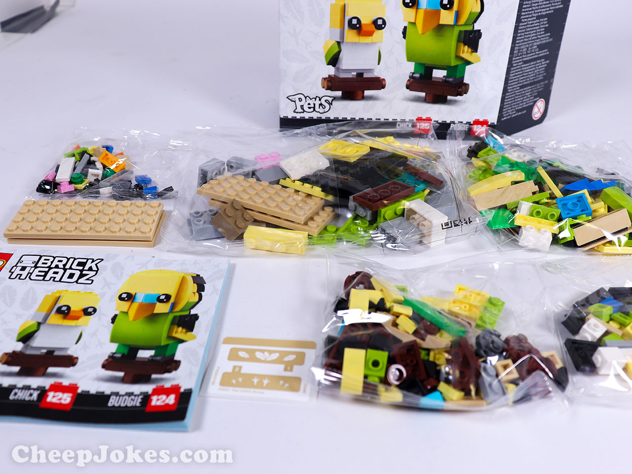 Bird fans will flock to this BrickHeadz™ Budgie (40443) build-and-display set. The budgie and chick both sit on iconic BrickHeadz stands designed to look like wooden bird perches. The stands fit into a sturdy brown base that resembles the bottom of a birdcage and comes with 2 stickers – 1 with feathers, 1 with footprints – for decorating the base. This buildable pet set is a perfect gift for all kids, BrickHeadz collectors and anyone who loves birds.